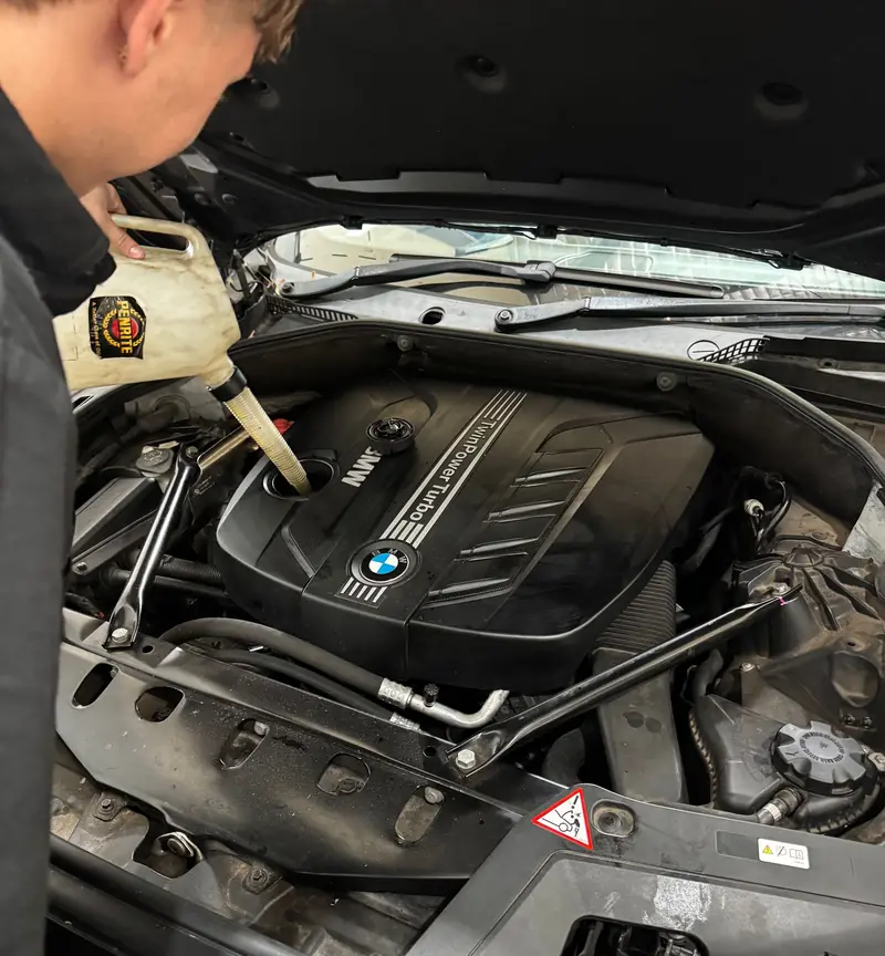 Topping up fluids during a car service