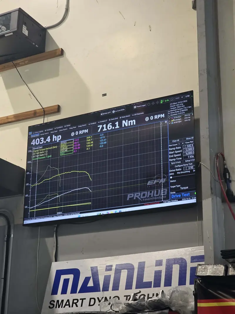 Mainline dyno screen at Elite Fleet Auto showing 403.4 hp and 716.1 Nm from an LS1-powered BMW E30