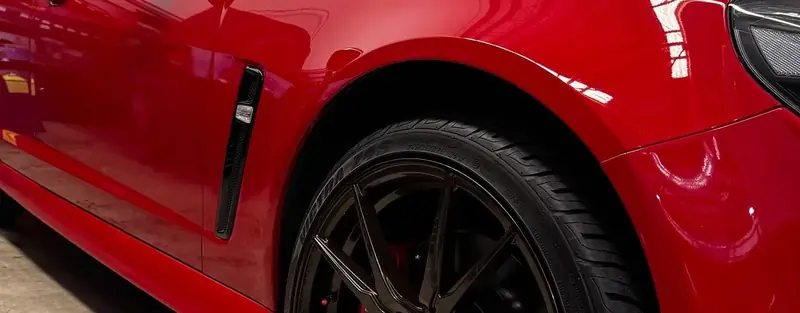 Red performance car side profile