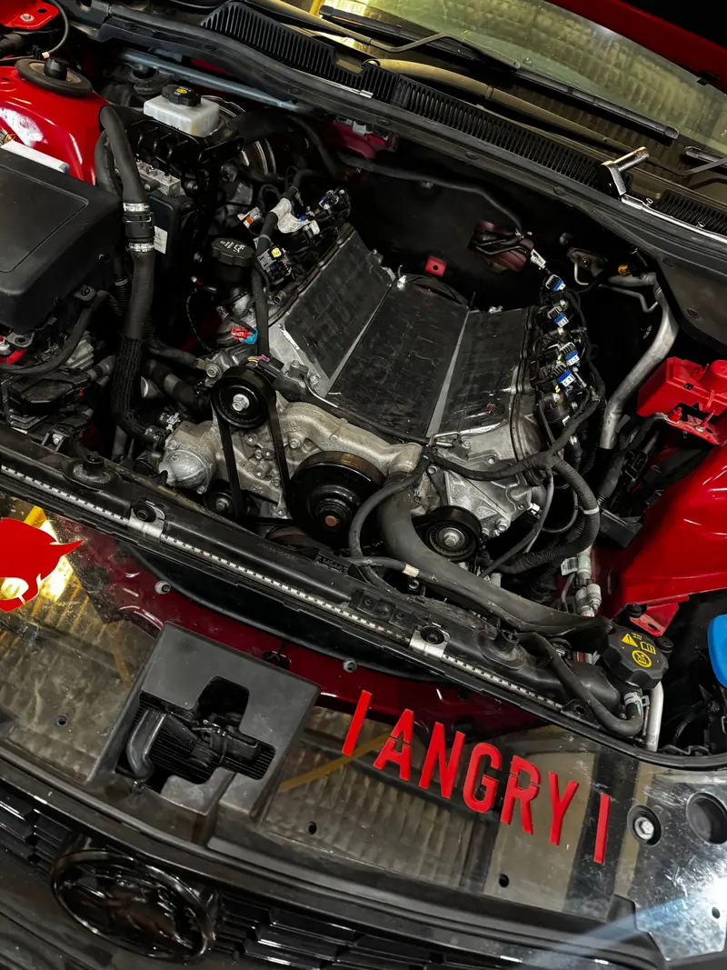 Close-up of a V8 engine bay after performance work