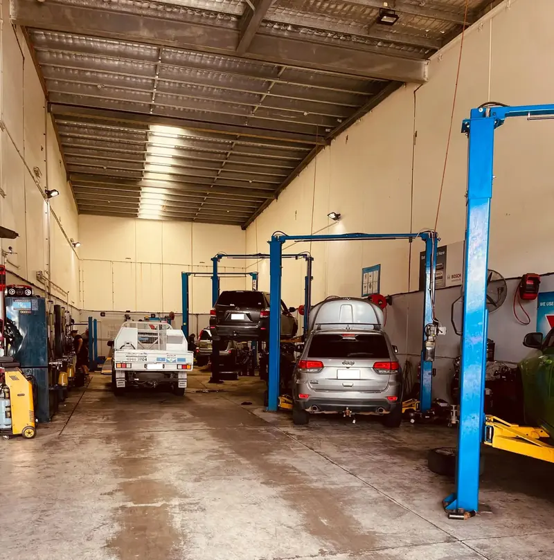 Two-post hoists and service bays at the Elite Fleet Auto workshop